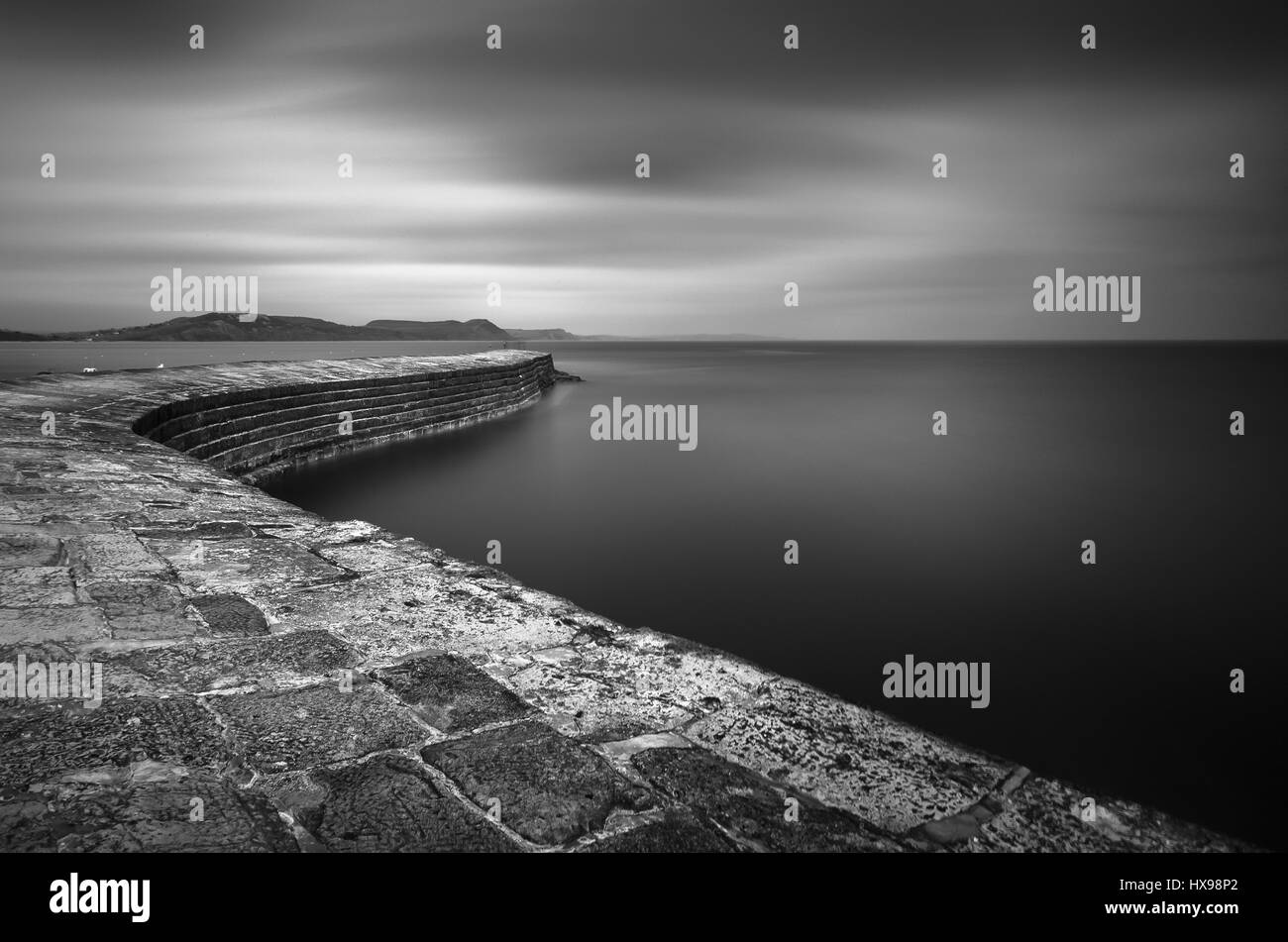 The stone Cobb,harbour wall, a famous landmark of Lyme Regis, Jurassic Coast Southwest England Stock Photo