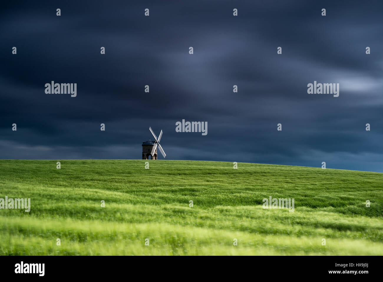 Chesterton Windmill and green wheat field as a Summer storm passes over, Warwickshire, United Kingdom Stock Photo