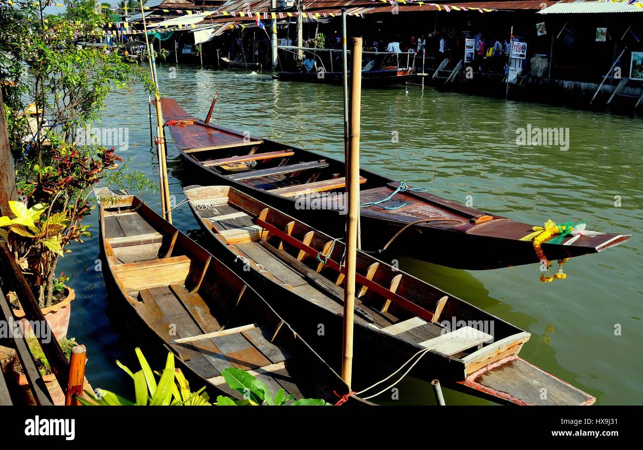 Amphawa, Thailand - December 17, 2010:  Moored flat-bottom wooden vendor boats docked on the Mae Klong canal at the Amphawa Floating Market Stock Photo