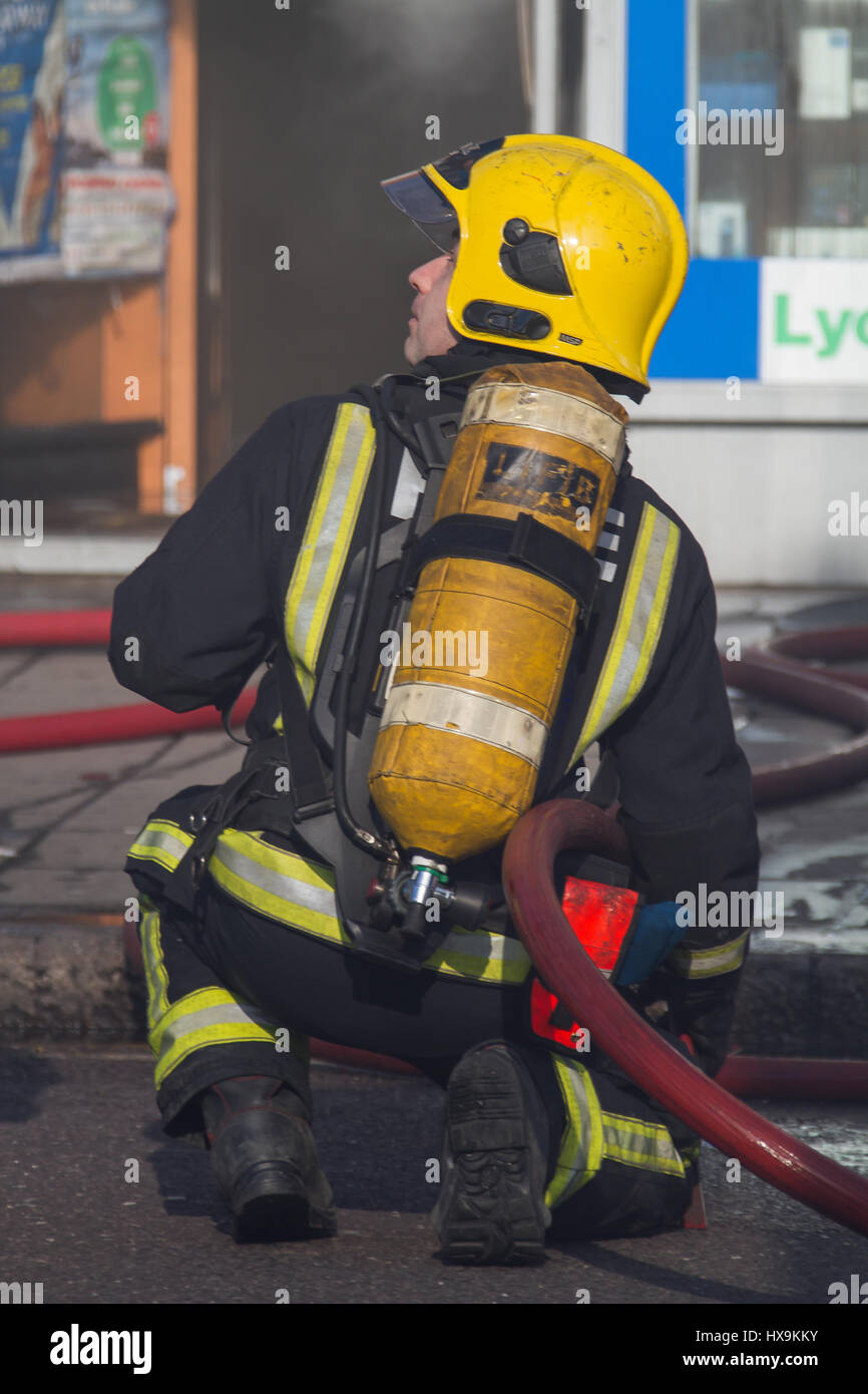 Ilford, UK. 25th Mar, 2017. Saturday 25/03/17 Six fire engines and around 30 firefighters tackled a blaze in a retail premises on Cranbrook Road in Ilford, The Brigade were called at around 3pm on Saturday afternoon. The fire resulted in the road being closed to traffic whilst fire crews dealt with the blaze. It is understood that the blaze was caused by an electrical fault and is being investigated by London Fire Brigade There are thought to be no injuries as a result of the blaze, London Ambulance Service sent several units to the scene of the blaze. Credit: Ian Marlow/Alamy Live News Stock Photo