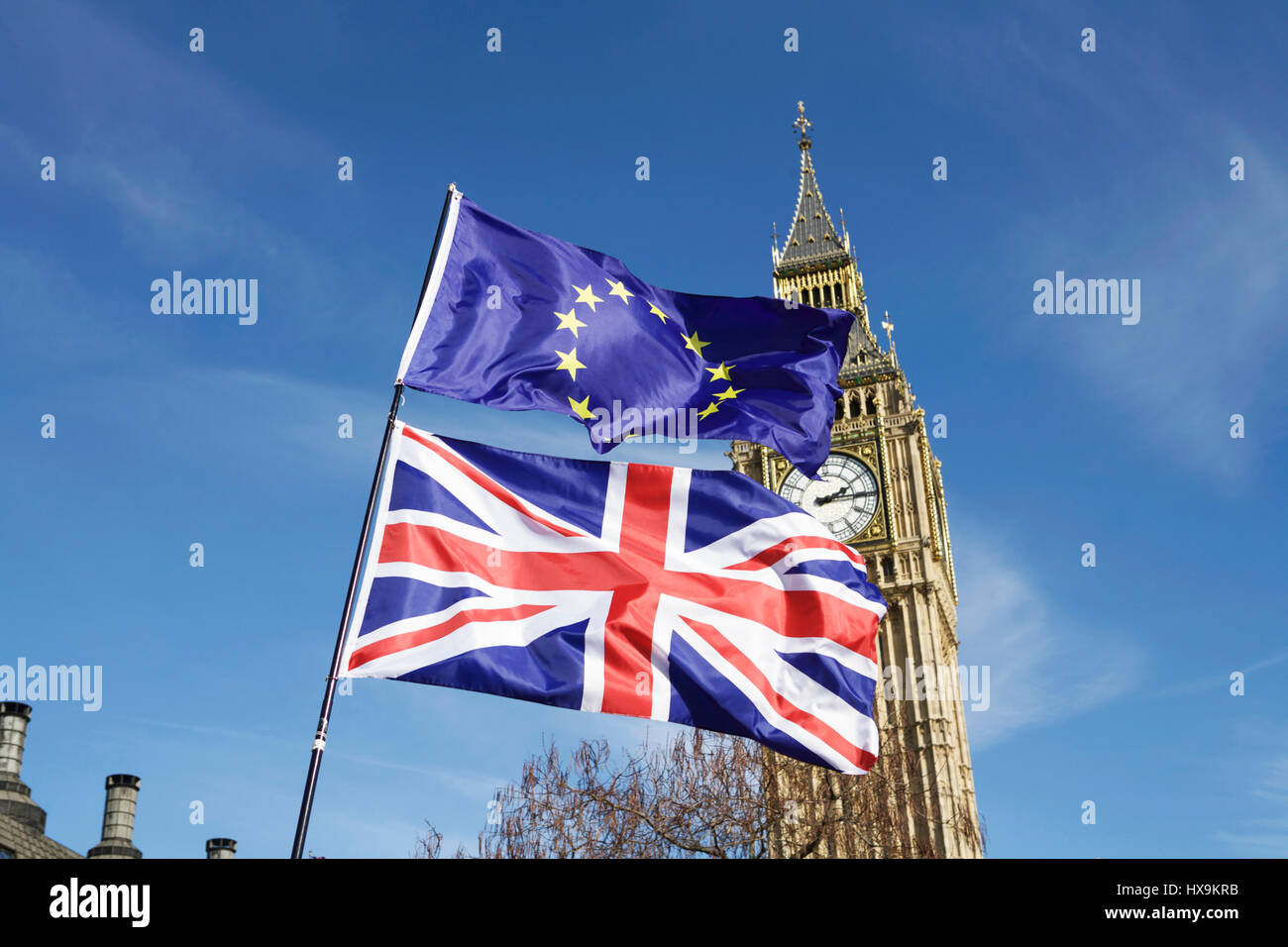 London, UK. 25th March 2017. Unite for Europe organised a Pro-EU march in London. Anti-BREXIT demonstrators march from Park Lane to Parliament Square. BREXIT flag, flags, Union Jack flag, EU flag, European flag, Big Ben. Parliament flags. UK politics UK. Brexit concept. British democracy. Vote Brexit. uk parliament brexit deal. Trade talks. Stock Photo