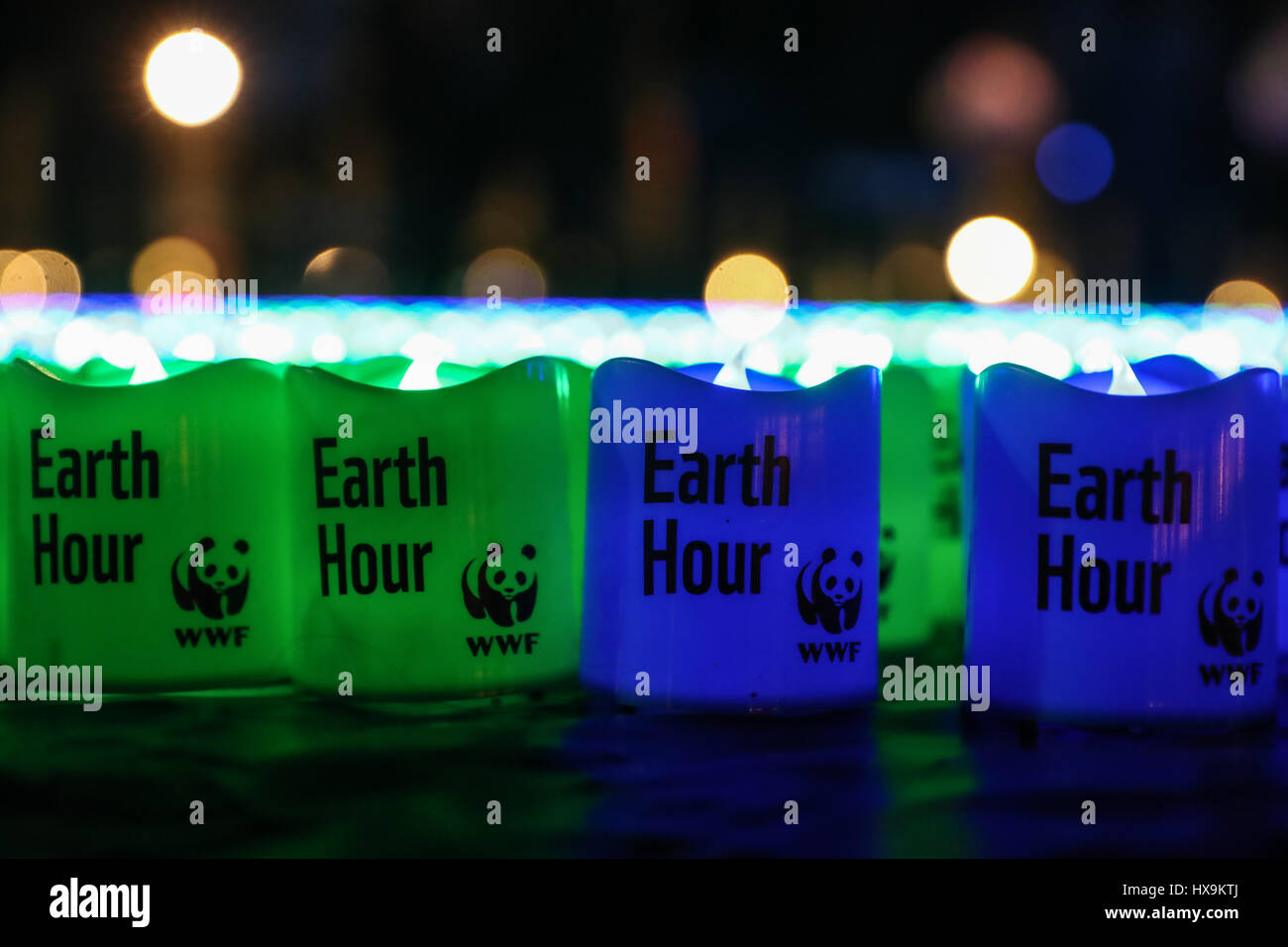 Berlin. 25th Mar, 2017. Photo taken on March 25, 2017 shows lights with words "Earth Hour" placed on the ground for the annual Earth Hour event in Berlin, capital of Germany. Credit: Shan Yuqi/Xinhua/Alamy Live News Stock Photo