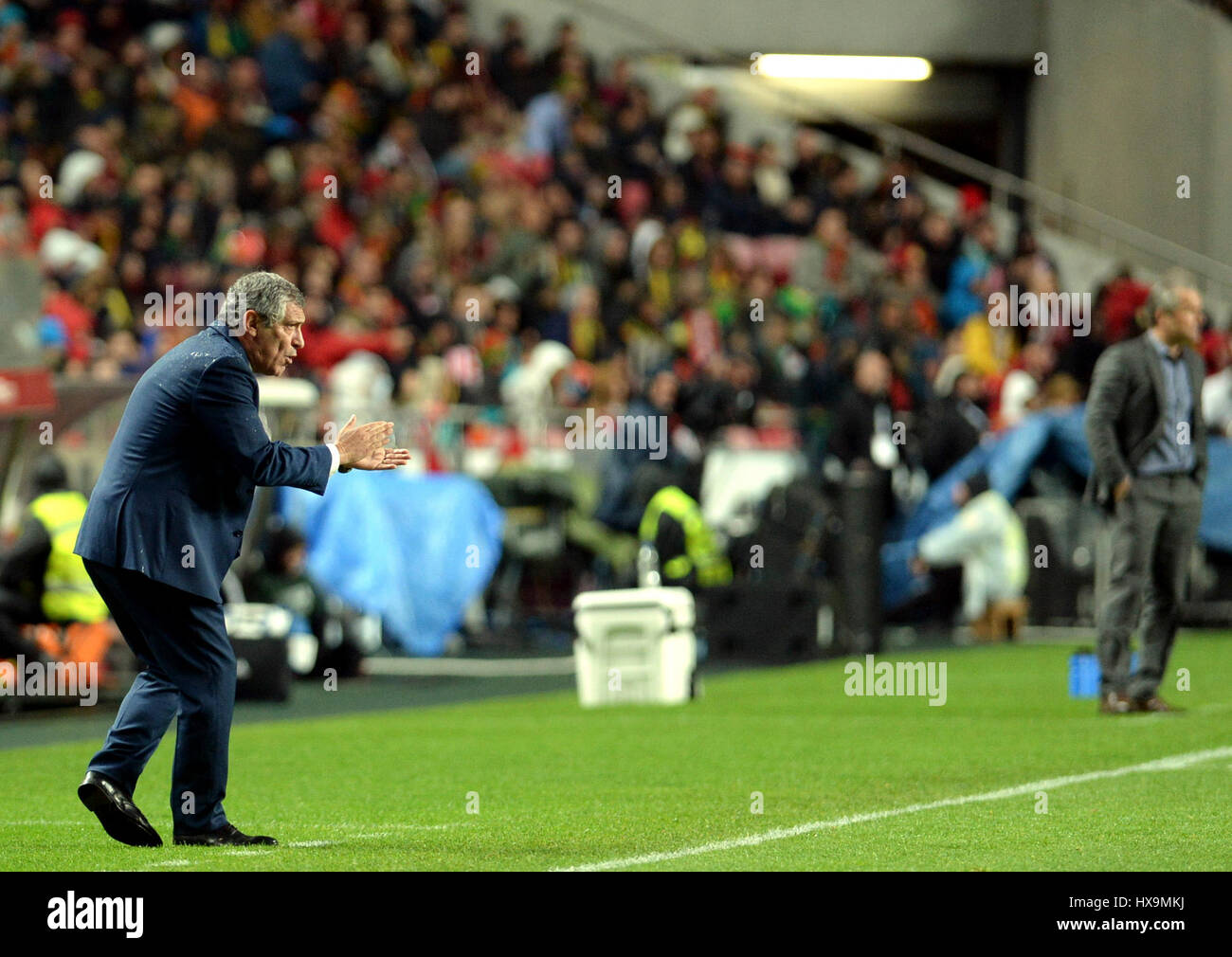 Lisbon, Portugal. 25th Mar, 2017. Fernando Santos(L), head coach of Portugal reacts during the FIFA World Cup 2018 Qualifiers Group B match between Portugal and Hungary at the Luz stadium in Lisbon, Portugal, on March 25, 2017. Portugal won 3-0. Credit: Zhang Liyun/Xinhua/Alamy Live News Stock Photo