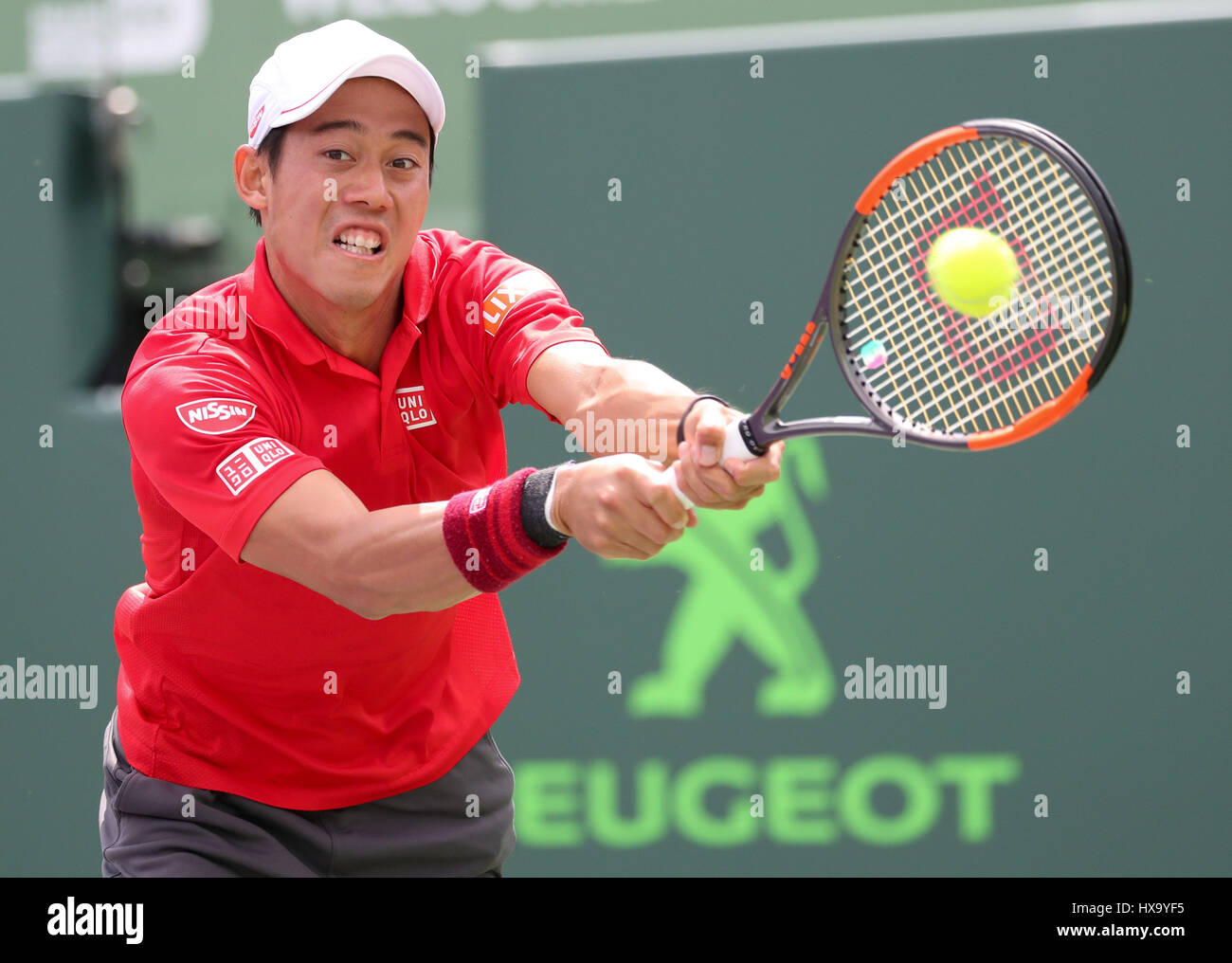 Key Biscayne, Florida, USA. 26th Mar, 2017. Kei Nishikori, of Japan, hits a backhand against Fernando Verdasco, of Spain, during his winning match at the 2017 Miami Open presented by Itau professional tennis tournament, played at Crandon Park Tennis Center in Key Biscayne, Florida, USA. Nishikori d Verdasco 7-6(2) 6-7(5) 6-1. Mario Houben/CSM/Alamy Live News Stock Photo