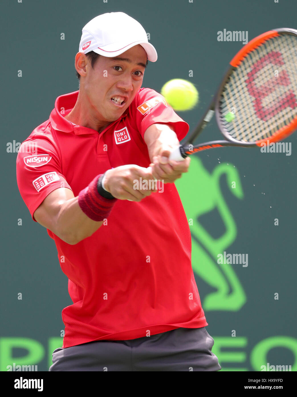 Key Biscayne, Florida, USA. 26th Mar, 2017. Kei Nishikori, of Japan, hits a backhand against Fernando Verdasco, of Spain, during his winning match at the 2017 Miami Open presented by Itau professional tennis tournament, played at Crandon Park Tennis Center in Key Biscayne, Florida, USA. Nishikori d Verdasco 7-6(2) 6-7(5) 6-1. Mario Houben/CSM/Alamy Live News Stock Photo