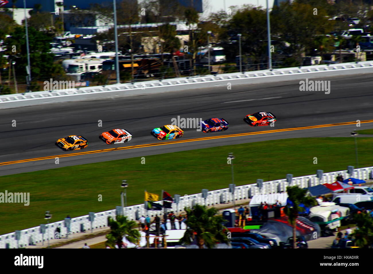A group of NASCAR Toyota Camrys work together in the opening laps of the 2017 Daytona 500. Stock Photo