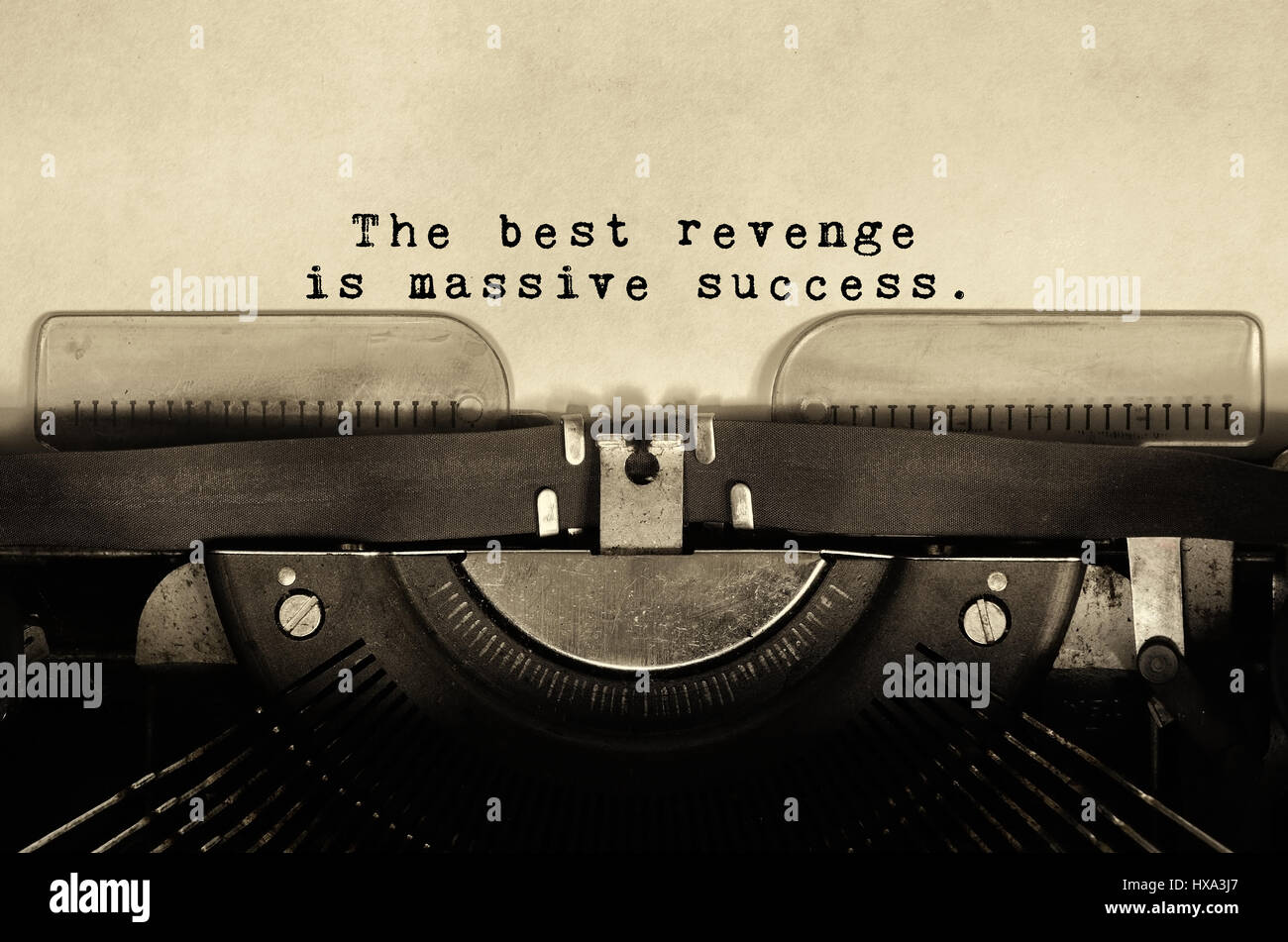 Inspirational quotes the best revenge is massive success typed on vintage typewriter Stock Photo