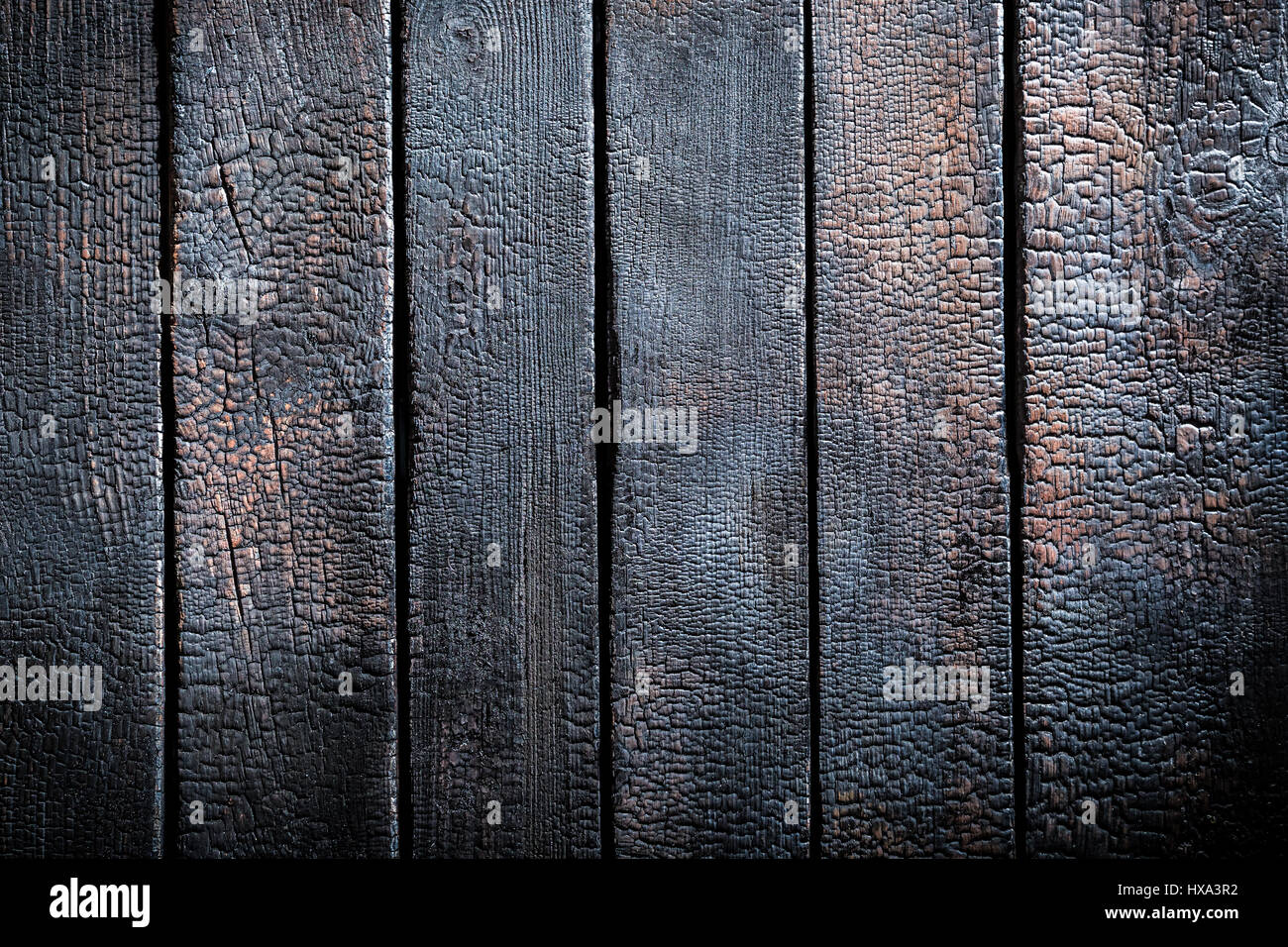 Black burnt black wooden table as background Stock Photo - Alamy