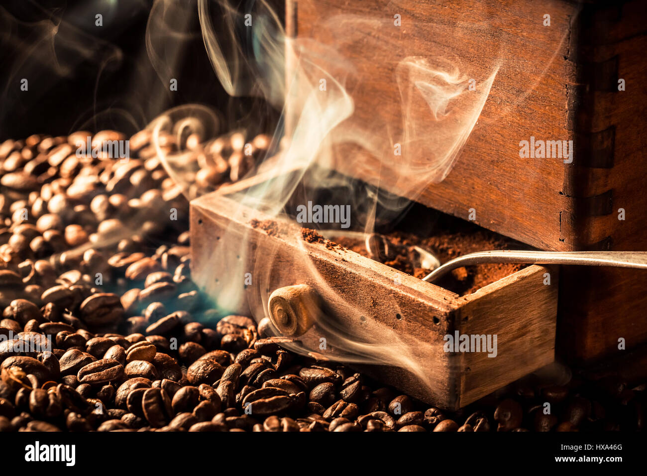 Aroma of roasted coffee beans on dark background Stock Photo - Alamy