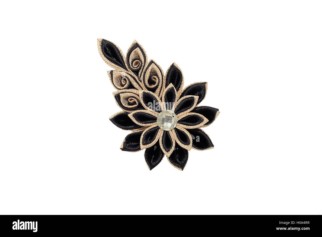 Kanzashi.Beautiful golden black artificial flower with brocade, isolated on white background Stock Photo