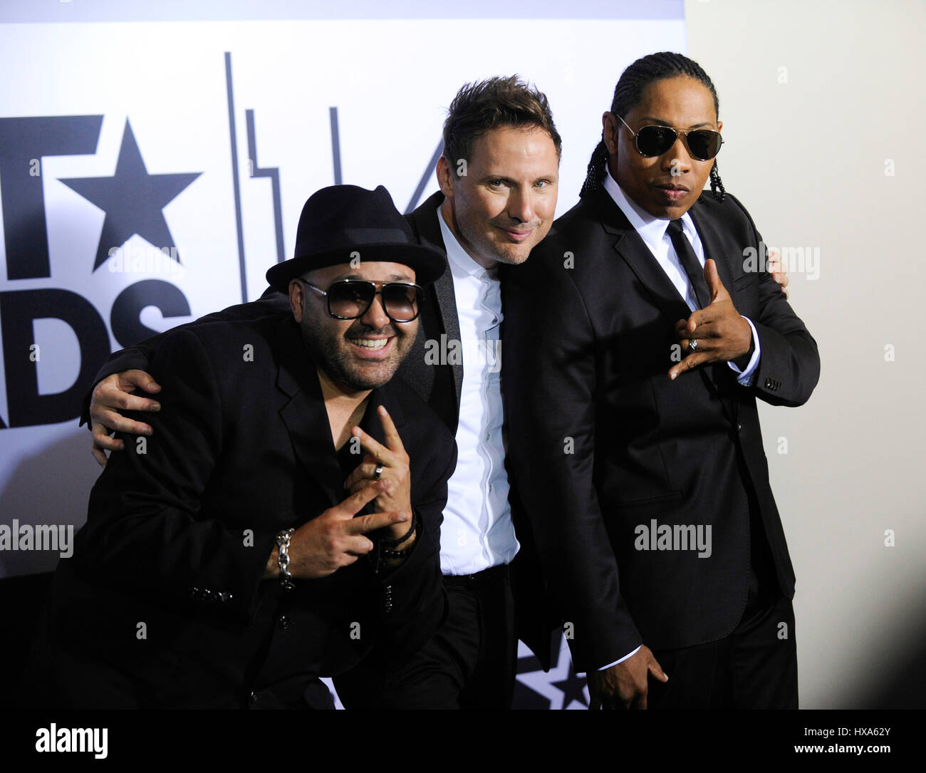 (L-R) Mark Calderon, Martin Kember and Kevin 'K.T.' Thornton of Color Me Badd pose in the press room at the 2014 BET Awards at Nokia Plaza L.A. LIVE on June 29, 2014 in Los Angeles, California. Stock Photo