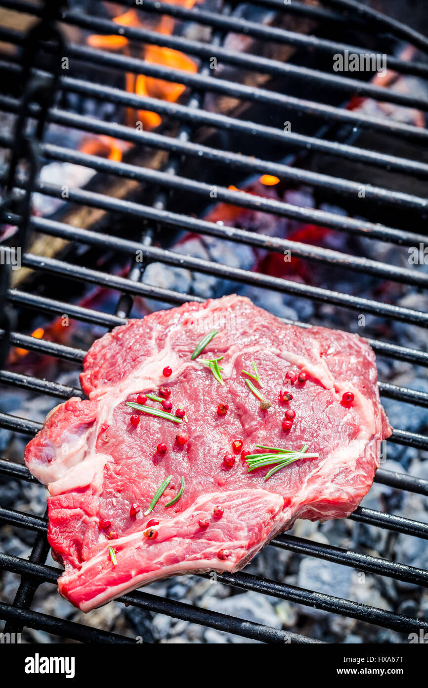 Red Meat With Rosted Roasting red beef with rosemary and pepper Stock Photo - Alamy