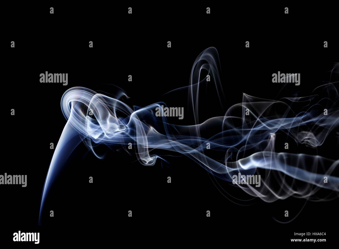 Abstract art. Color white blue smoke from the aromatic sticks on a