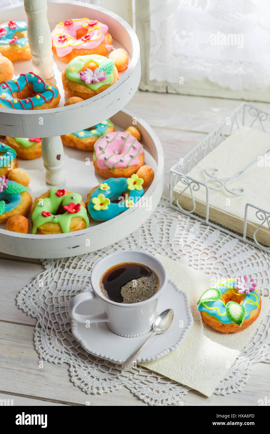 Homemade donuts served with coffee on old white table Stock Photo - Alamy