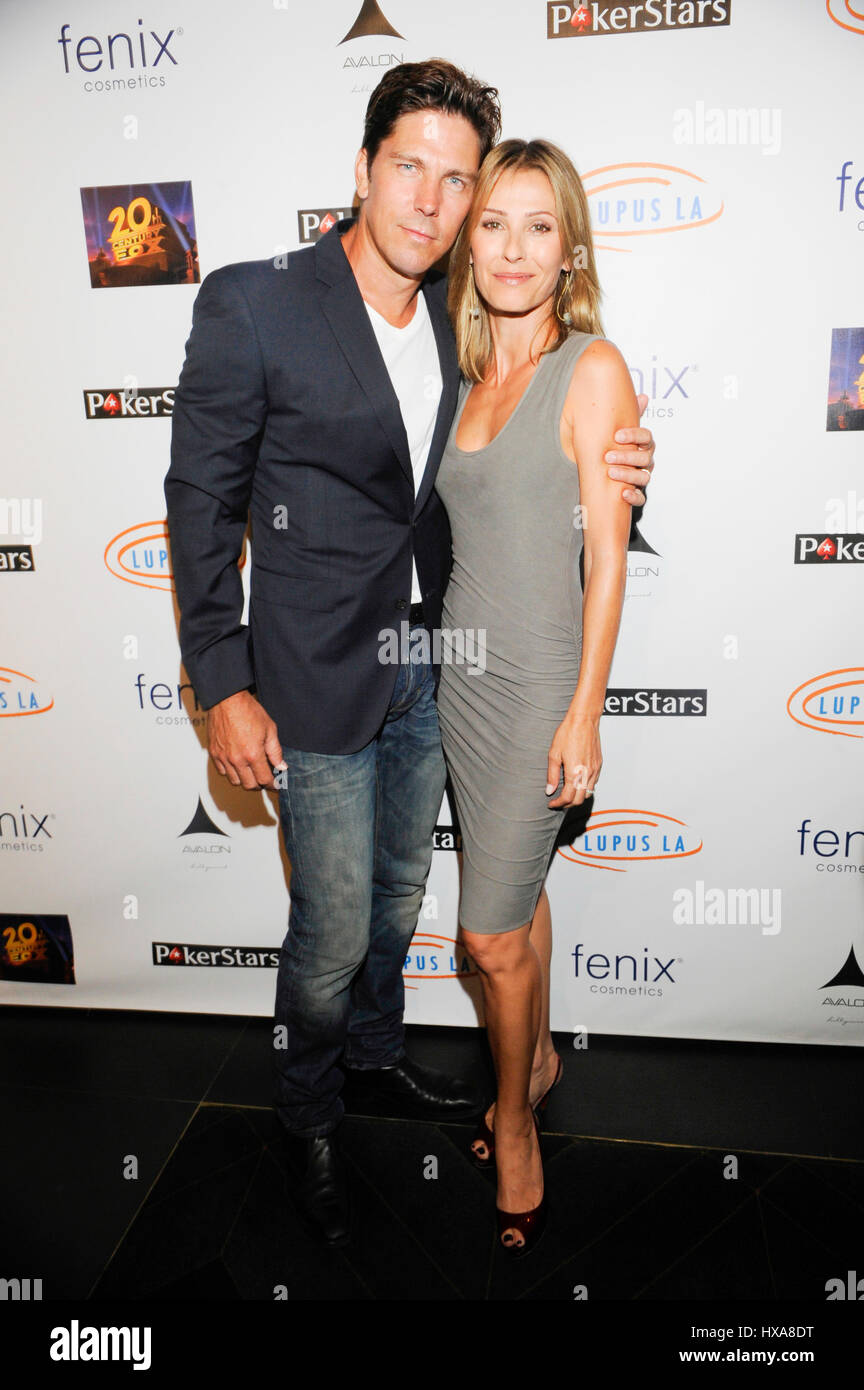 Actress Sandra Hess (L) and husband actor Michael Trucco attend the Stars Get Lucky For Lupus: 6th Annual Poker Tournament at Avalon on September 18, 2014 in Hollywood, California. Stock Photo