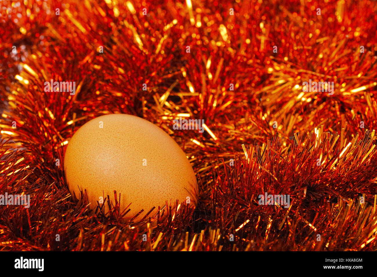 Egg in the glitter nest Stock Photo Alamy