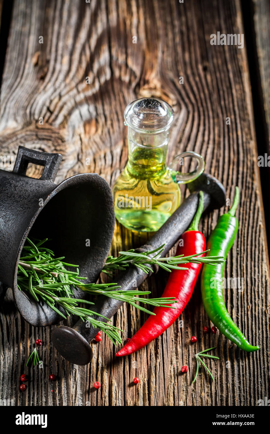 Mortar with colorful condiments on old wooden table Stock Photo - Alamy