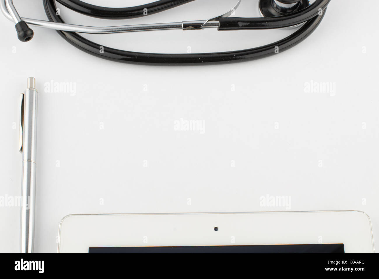 Tablet computer, pen and stethoscope on white background close Stock ...