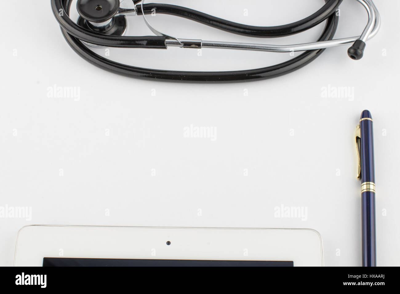 Tablet computer, pen and stethoscope on white background close Stock ...