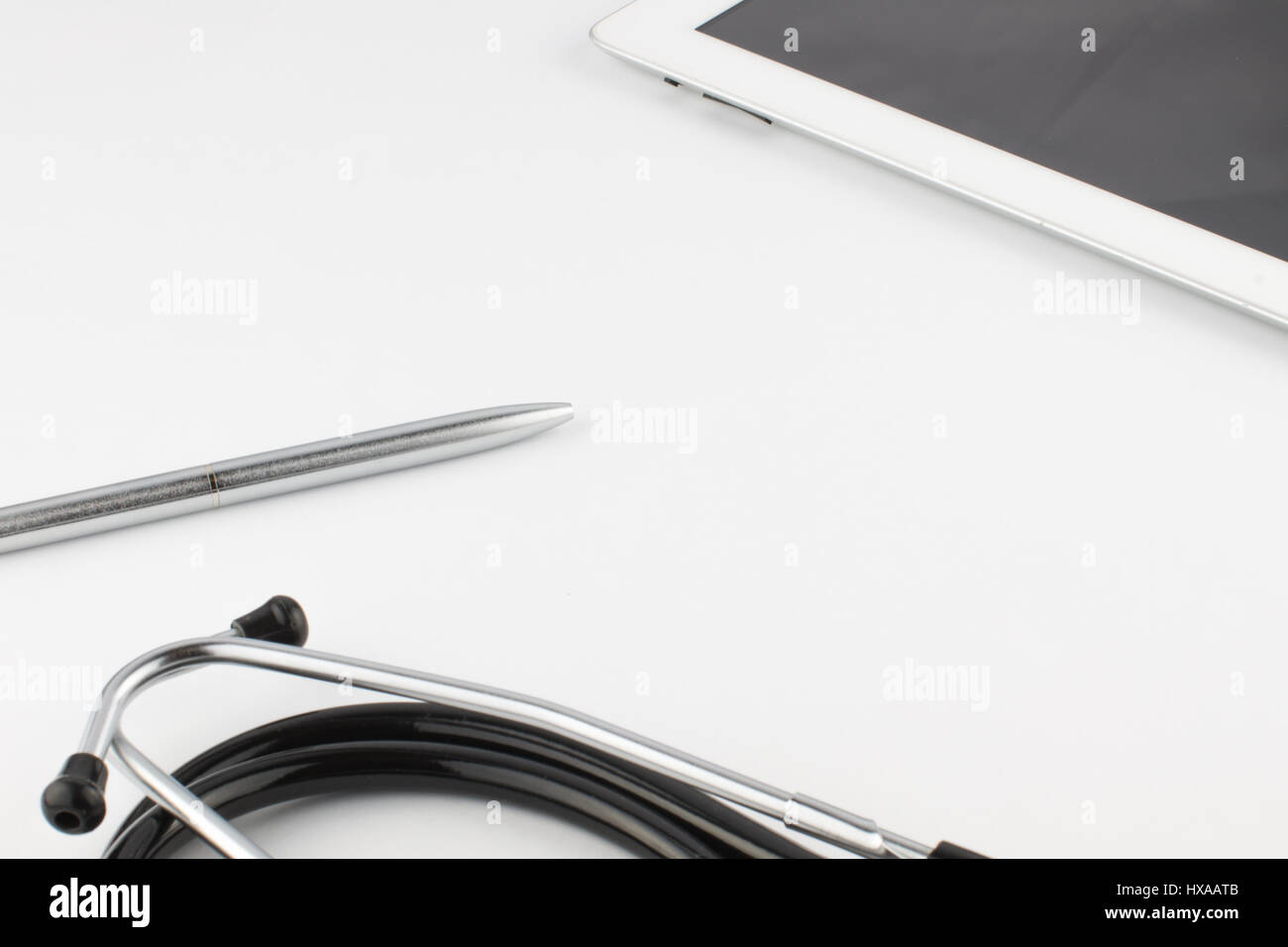 Tablet computer, pen and stethoscope on white background close Stock ...