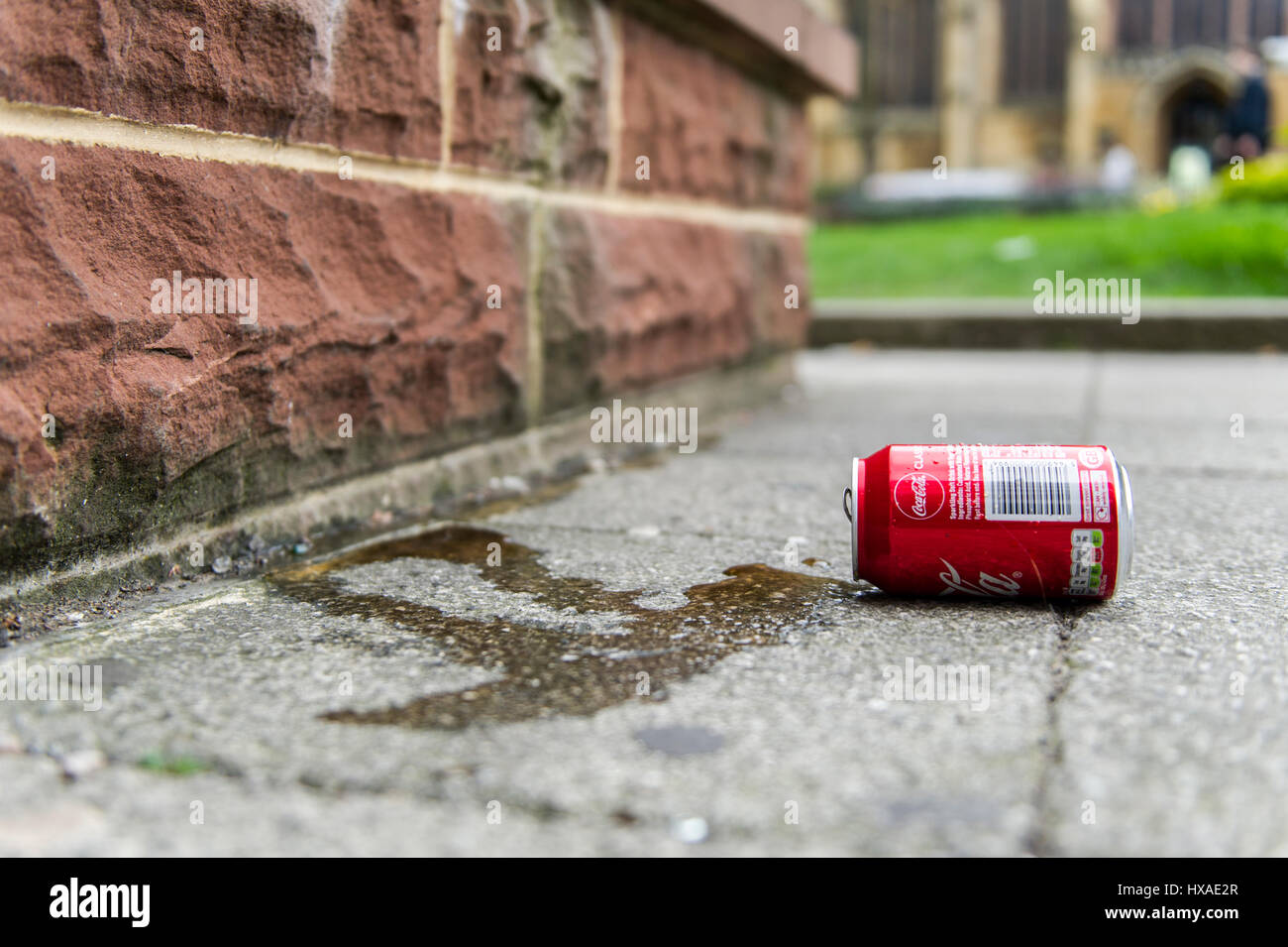 An empty Coca Cola can discarded, litter in Coventry, United Kingdom. Stock Photo