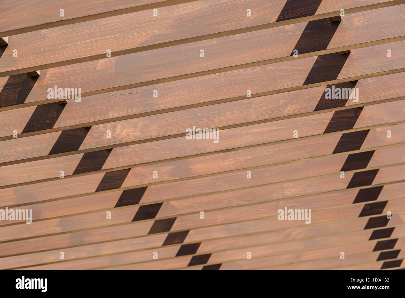 Row of painted wooden sticks as background Stock Photo - Alamy