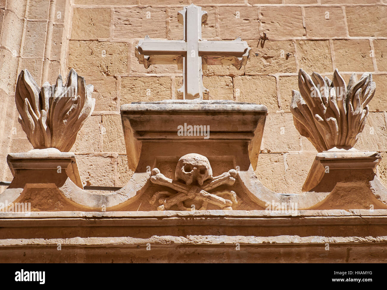 The Totenkopf, skull and crossbones, a dead's head symbol,  as a decorative element over the entrance to the residential house of Mdina. Malta Stock Photo