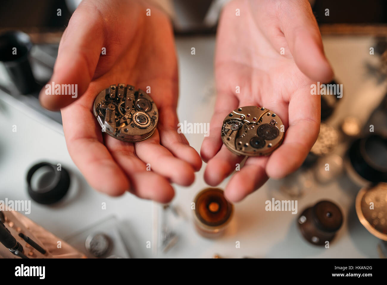 Female hands with fishing rod and alarm clock on color background