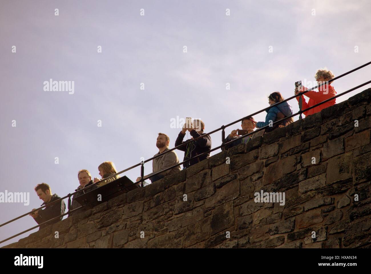 Edinburgh Castle tourist crowds on a sunny day explore the inside of the walls Stock Photo