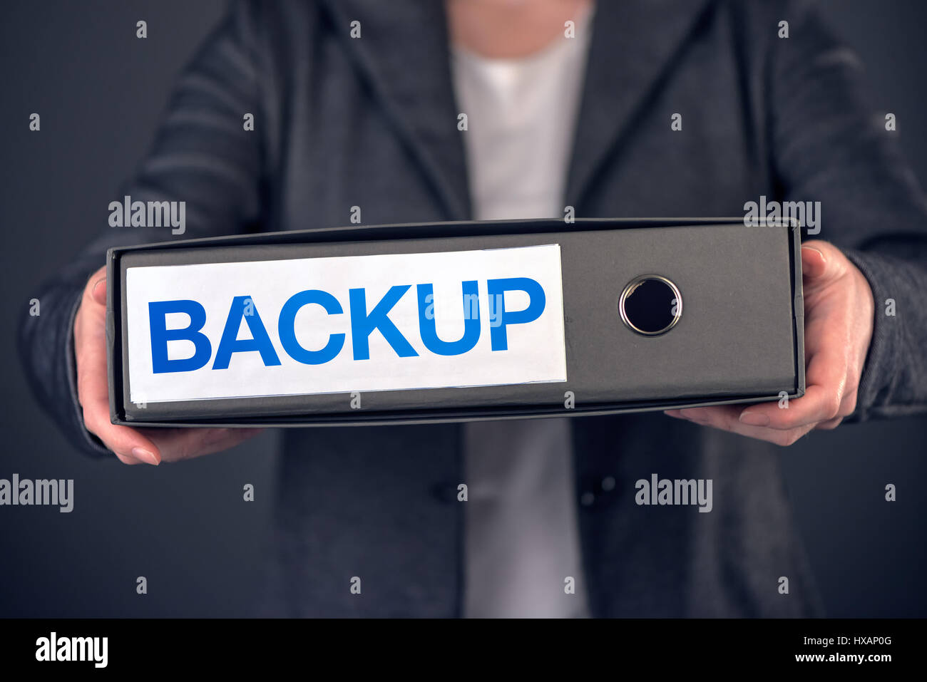 Backup business data concept, archive and keep safe. Businesswoman with document ring binder. Stock Photo
