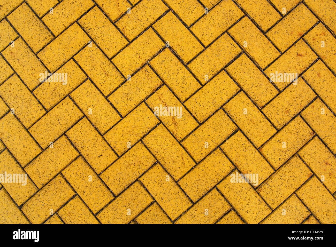 Zig zag yellow brick pavement, urban sidewalk texture Stock Photo