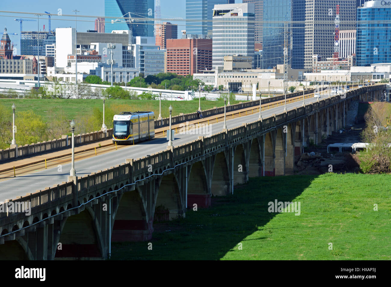 The Oak Cliff Streetcar crosses the Oak Cliff Viaduct over the Trinity River parkland between