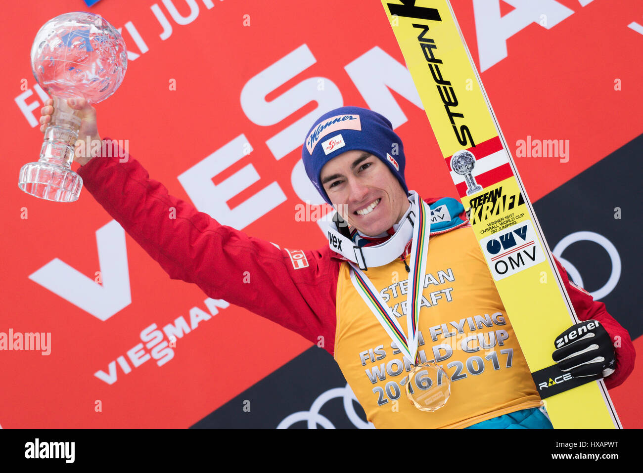 Planica, Slovenia. 26th Mar, 2017. Stefan Kraft of Austria on podium with  Crystal Globe celebrating his first place in overall World Cup Ski Flying  standings at the Planica FIS Ski Jumping World