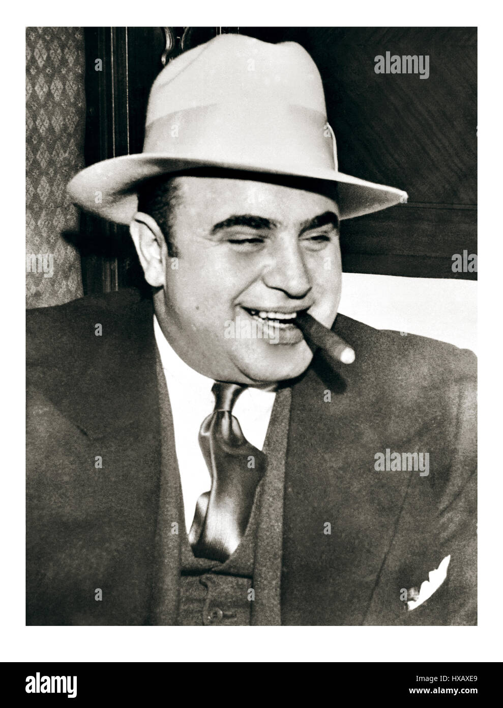 AL CAPONE CIGAR HAT 1920's Vintage B&W image of Al Capone, probably the most famous organized crime lord, or more commonly known as a Mafia mob gangster, in 1920's American history. Al Capone, byname of Alphonse Capone, also called Scarface, (born January 17, 1899, Brooklyn, New York, U.S.—died January 25, 1947, Palm Island, Florida), the most famous American gangster, who dominated organized crime in Chicago from 1925 to 1931. Stock Photo