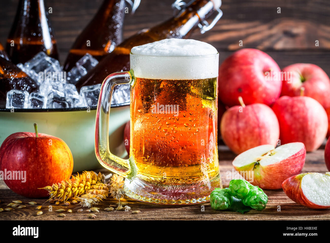 Cold and fresh cider beer with apples Stock Photo
