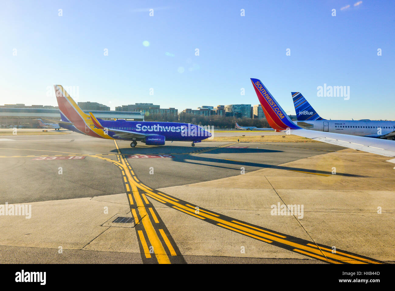 Southwest and Jet Blue airplanes at Tampa International Airport, taxiing on tarmac Stock Photo