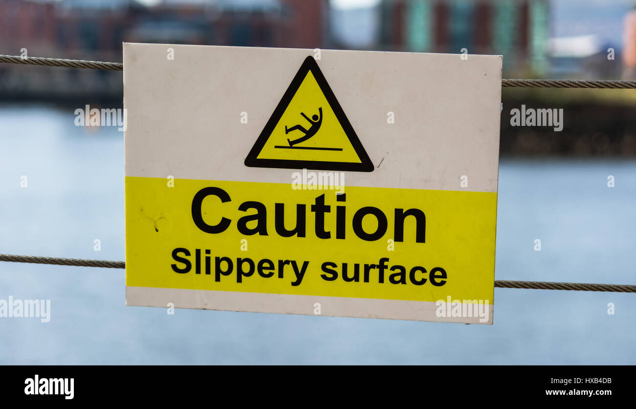 Caution Slippery Surface warning sign. Stock Photo