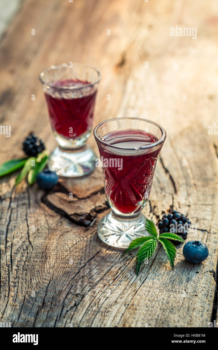 Homemade liquor with berry fruits and alcohol Stock Photo Alamy
