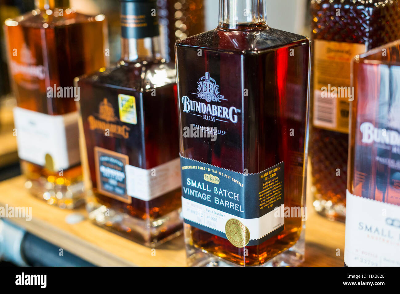 Bottles of rum products on the shelves of the Bundaberg Rum Distillery Visitor Centre, Bundaberg, Queensland, Australia Stock Photo