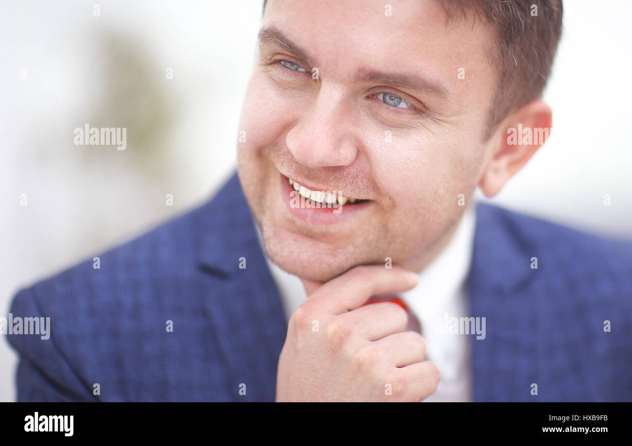Successful young businessman posing and smiling at Stock Photo - Alamy