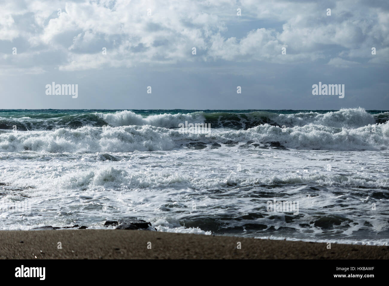 seascape showing powerful waves shot on cloudy day landscape layout Stock Photo