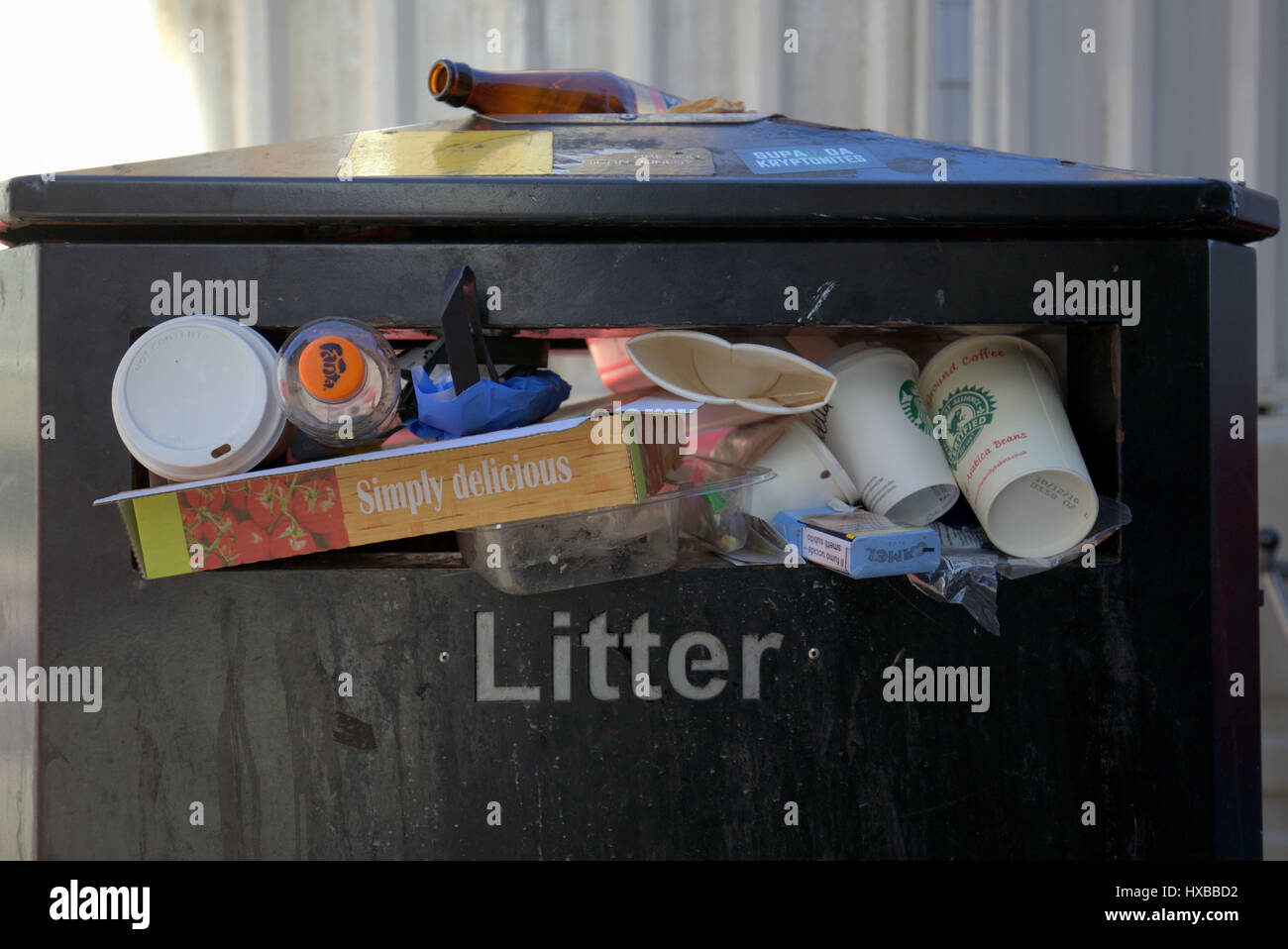 overflowing litter bin Stock Photo