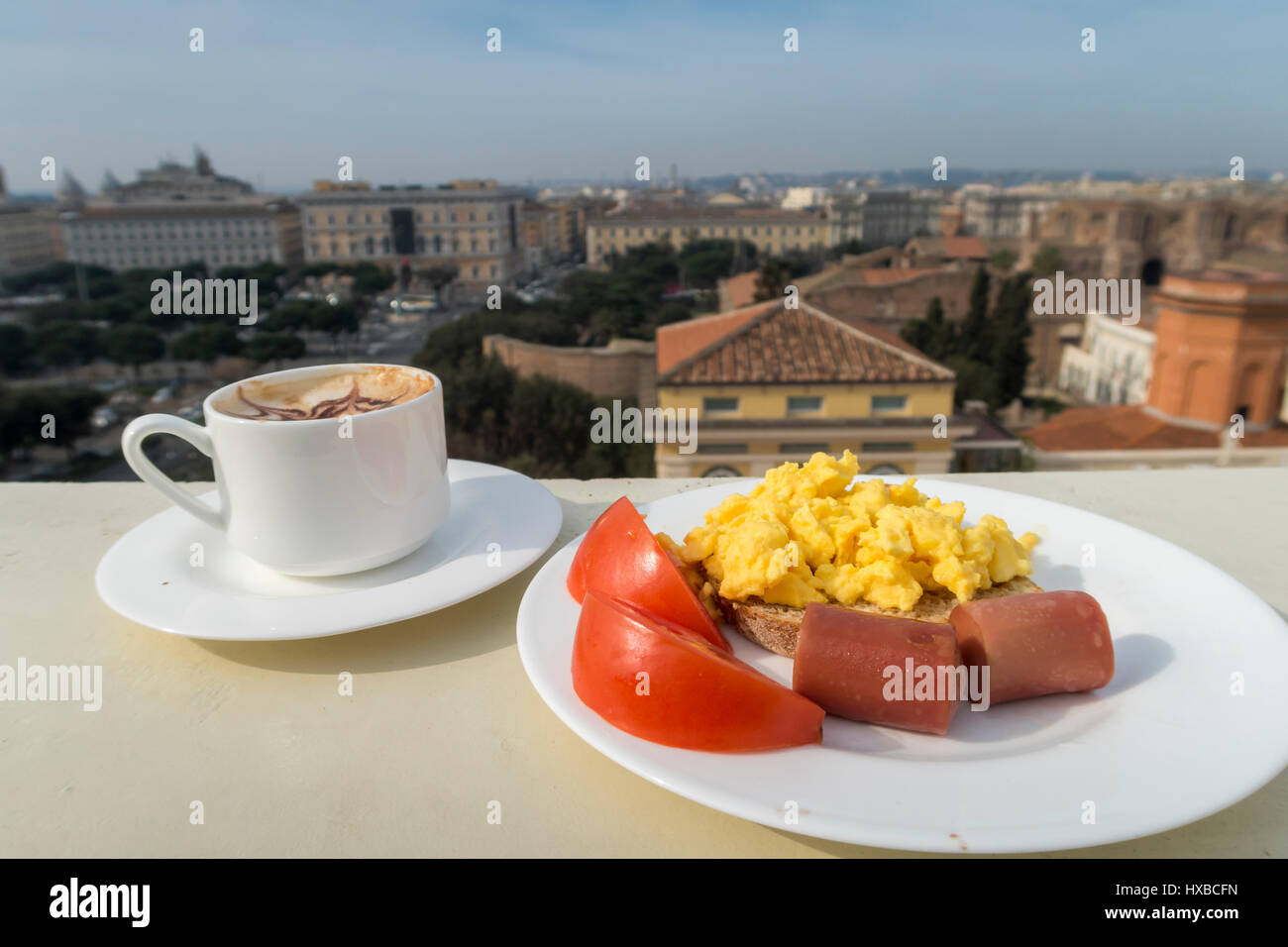 Healthy breakfast with tomato, sausage, scramble eggs and coffee Stock Photo
