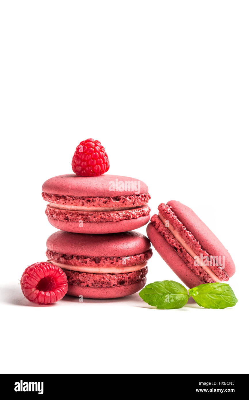 Small Macaroon Small macaroons with raspberries on white background Stock Photo - Alamy