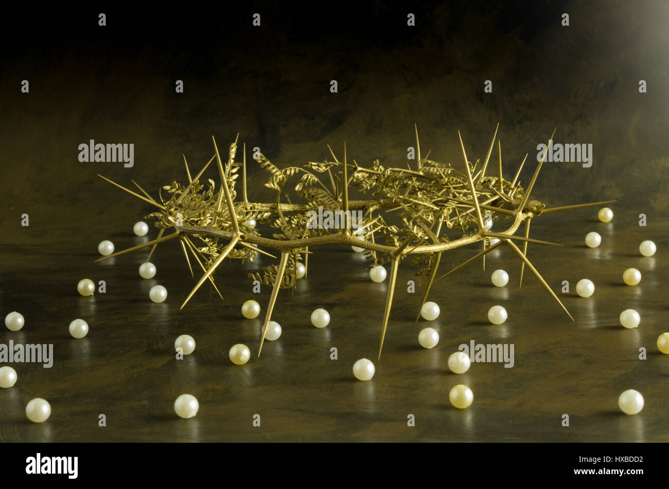 Gold thorn crown with pearls on grunge background Stock Photo - Alamy