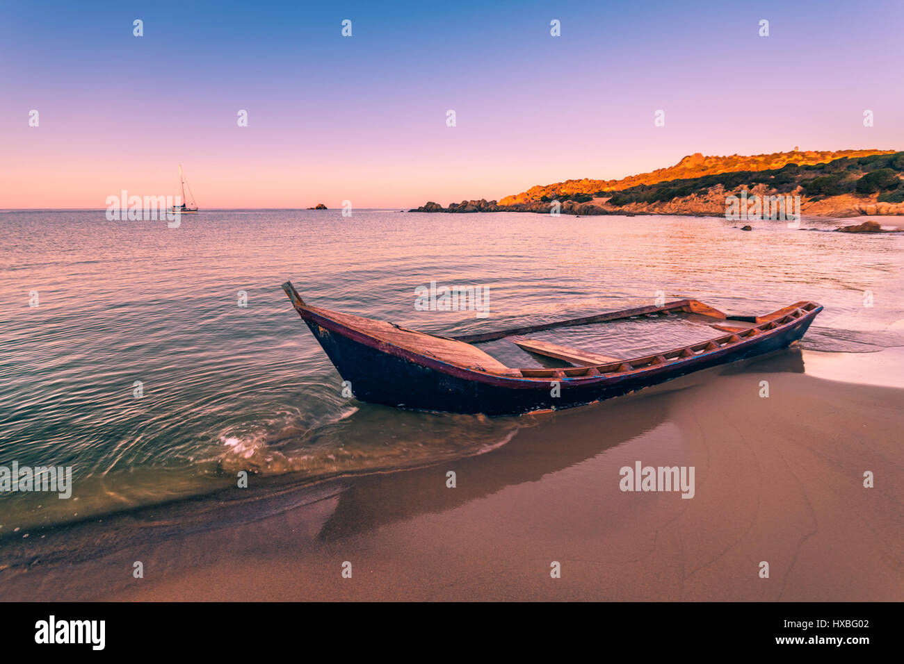 Old wooden boat wrecked on a sandy beach Stock Photo - Alamy