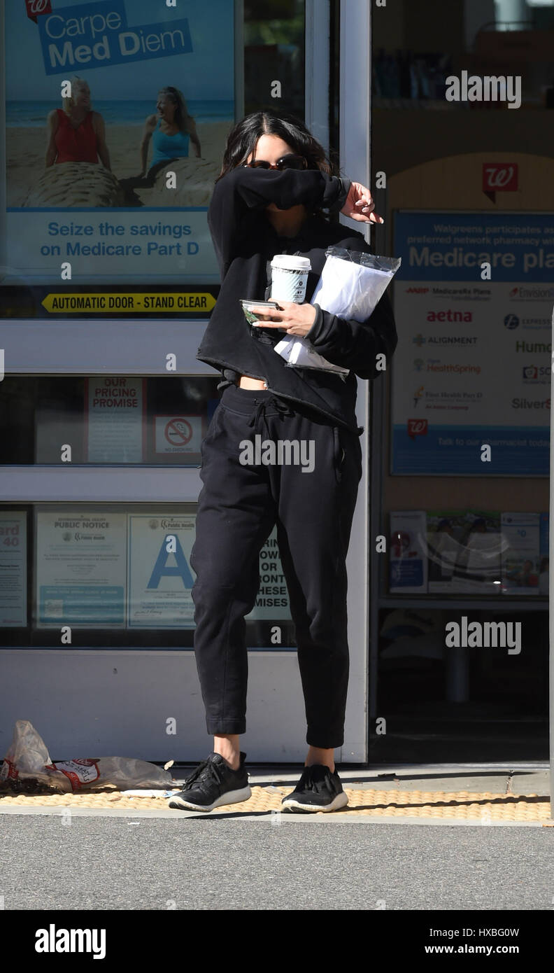 Vanessa Hudgens covers her face coming out of Walgreens Featuring