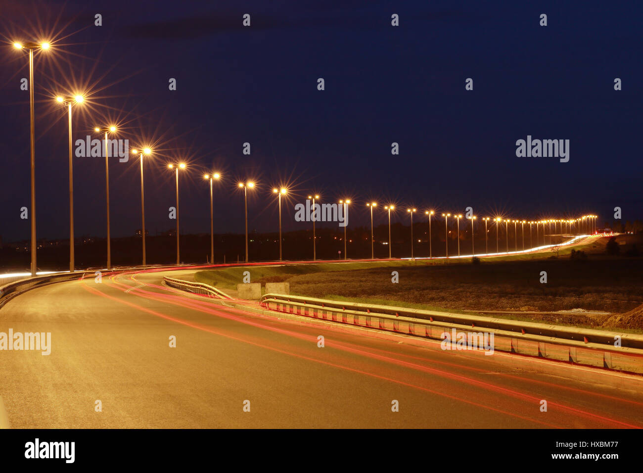 Lighting the night highway, road lighting masts, night view, horizontal