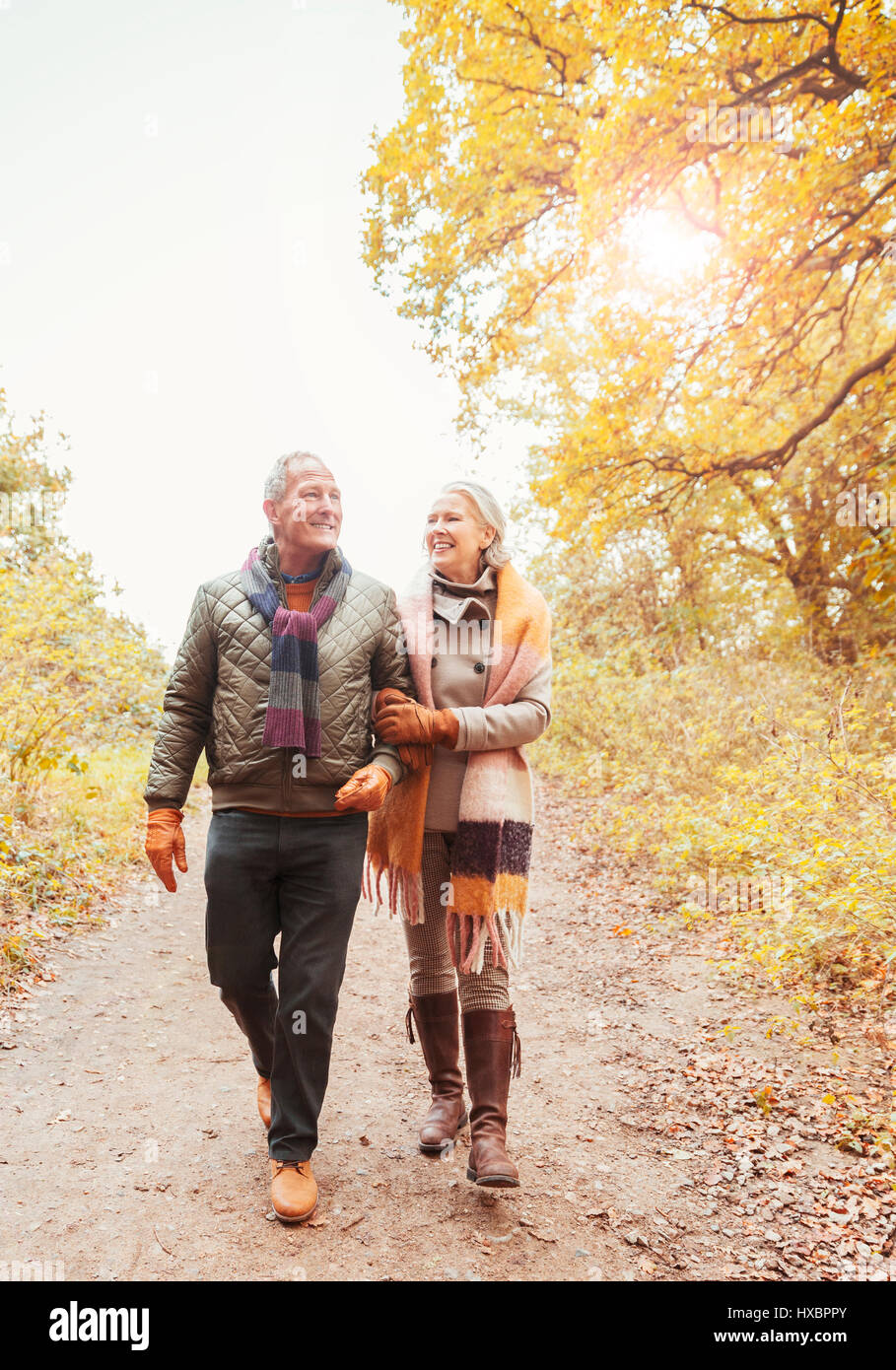 Walking arm in couple hi-res stock photography and images - Alamy