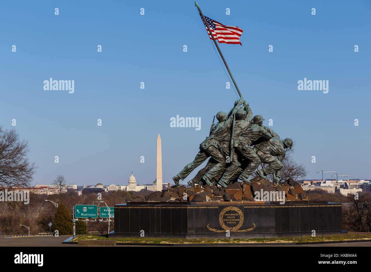 The US Marine Corps War Memorial with Washington landmarks in the background in Arlington, Virginia. Stock Photo